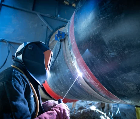 professional-welder-welding-pipe-pipeline-construction_342744-1573